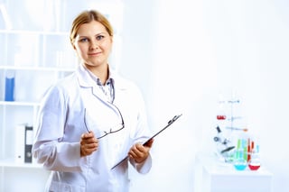 Scientist in uniform doing tests in laboratory.jpeg