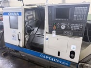 OKUMA CAPTAIN L370 CNC LATHE WITH OSP E-100L CONTROL w/ LNS Hydrobar (2003)